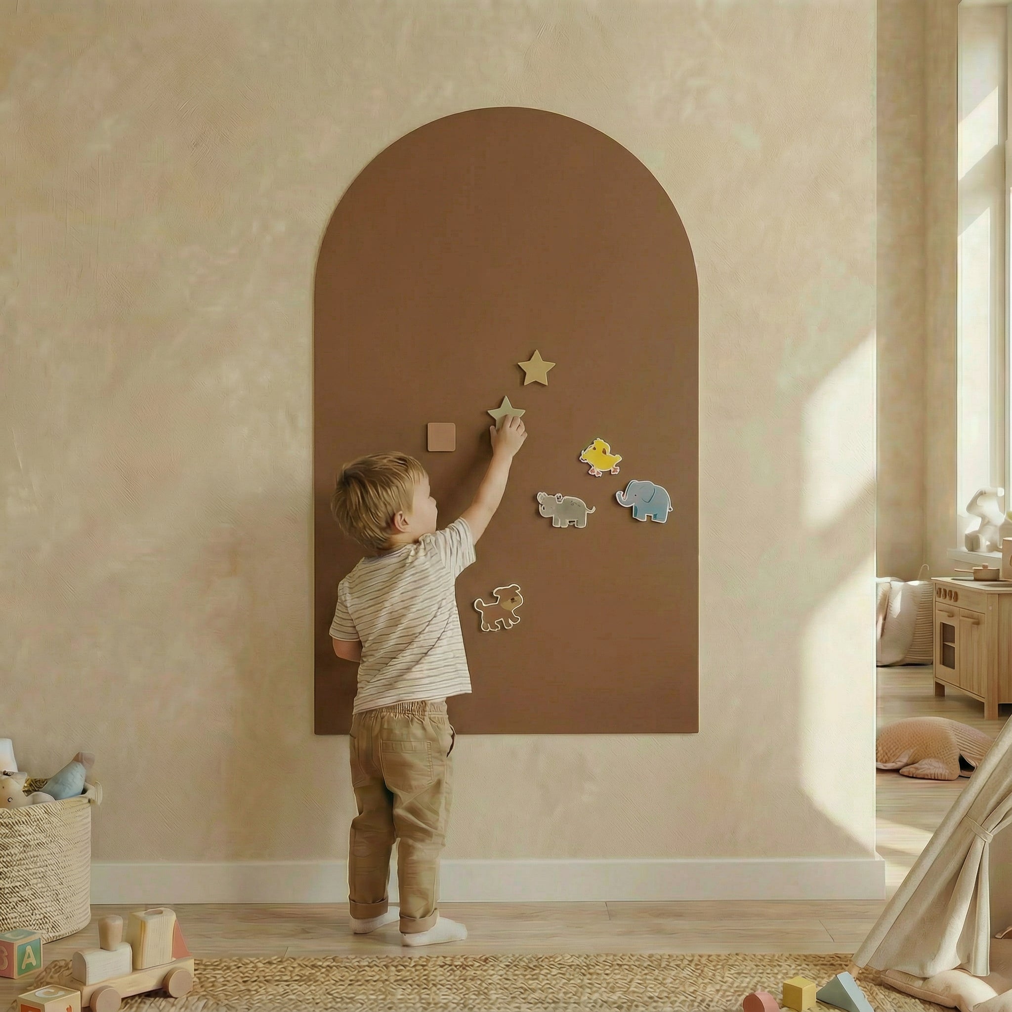 A child using a magnetic board for children, engaging with colorful animal shapes on a wall-friendly board.