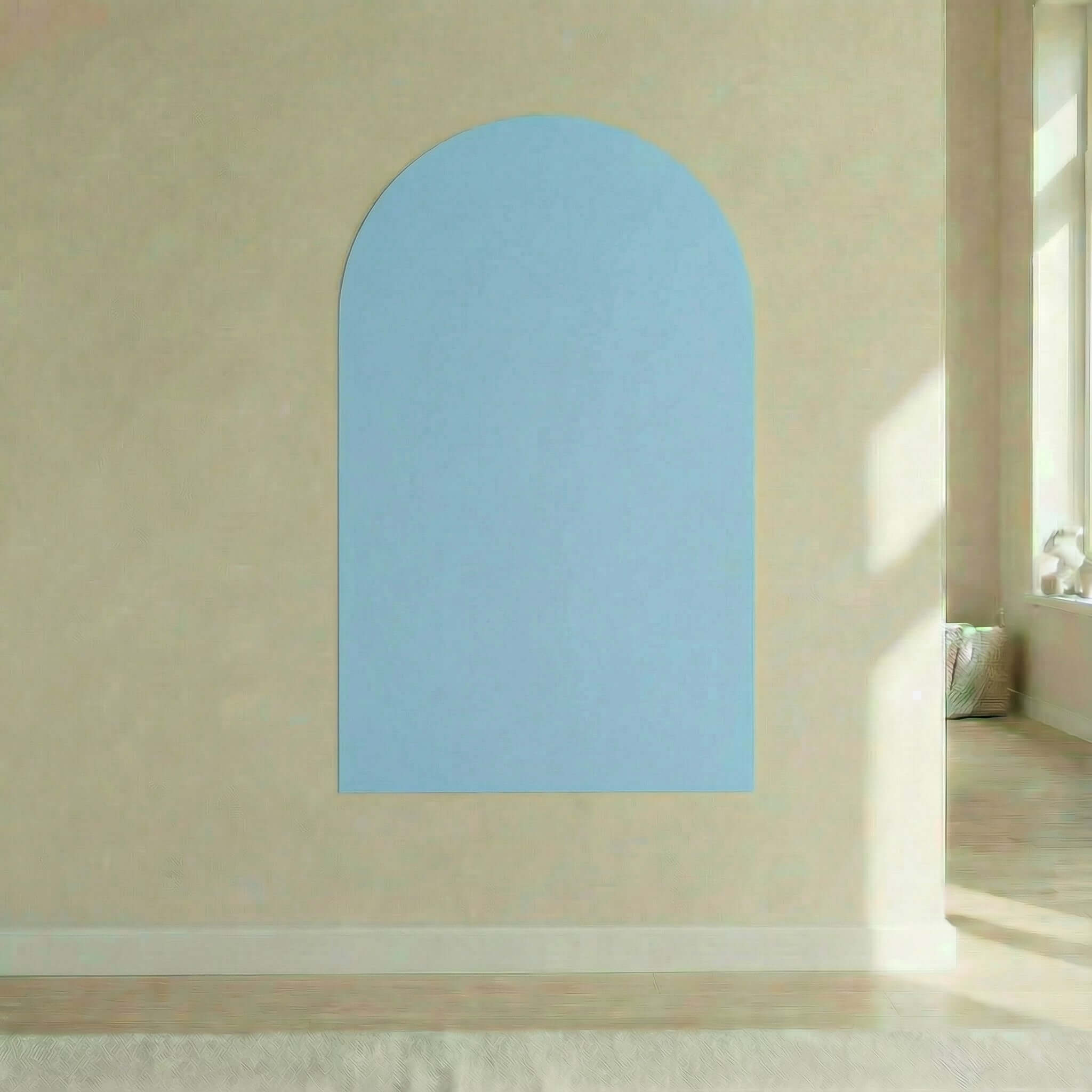 Magnetic board for children Petit Tableau in light blue color mounted on a wall, designed for easy removal.